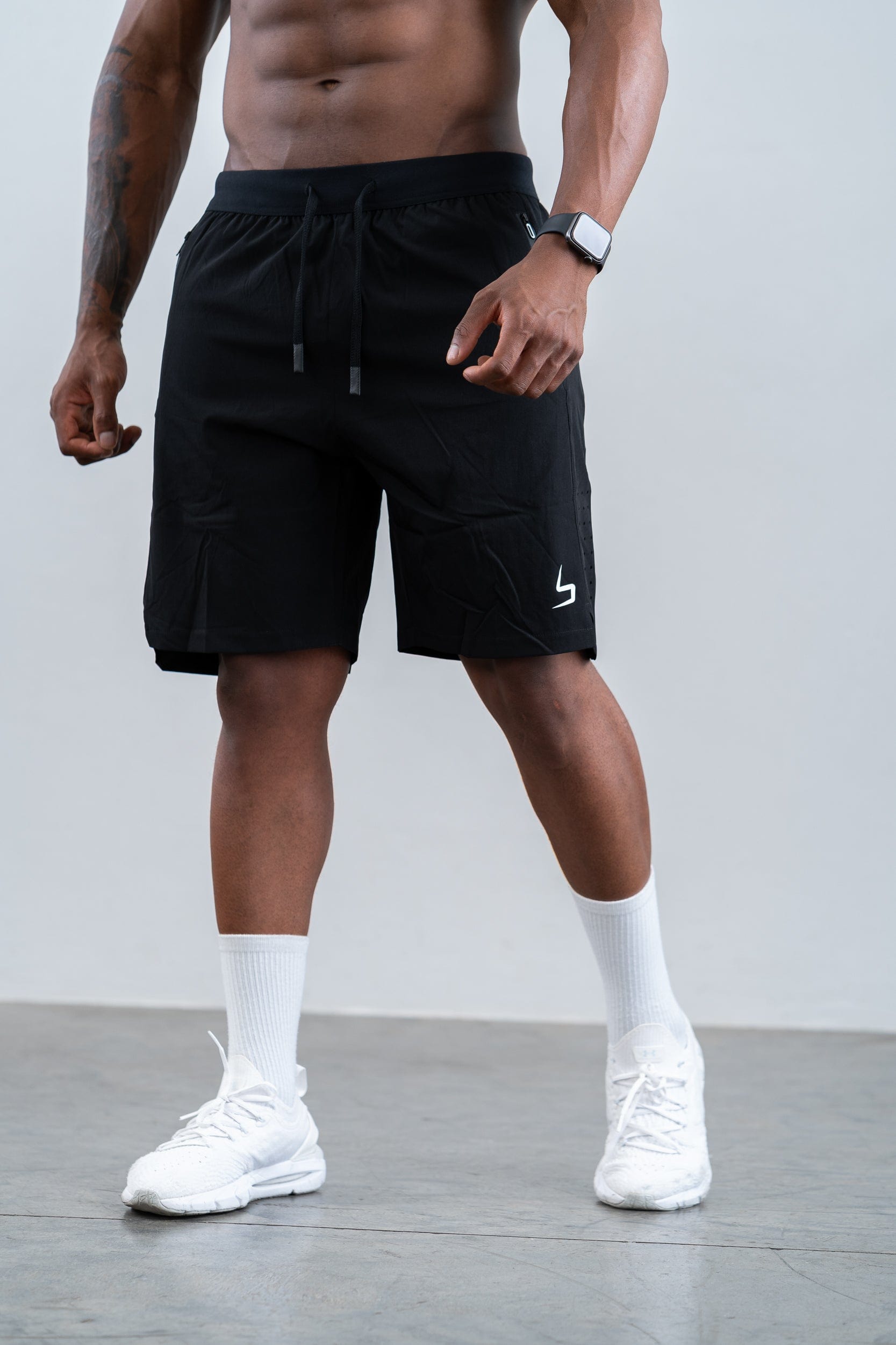 man wearing botthms black training sport short